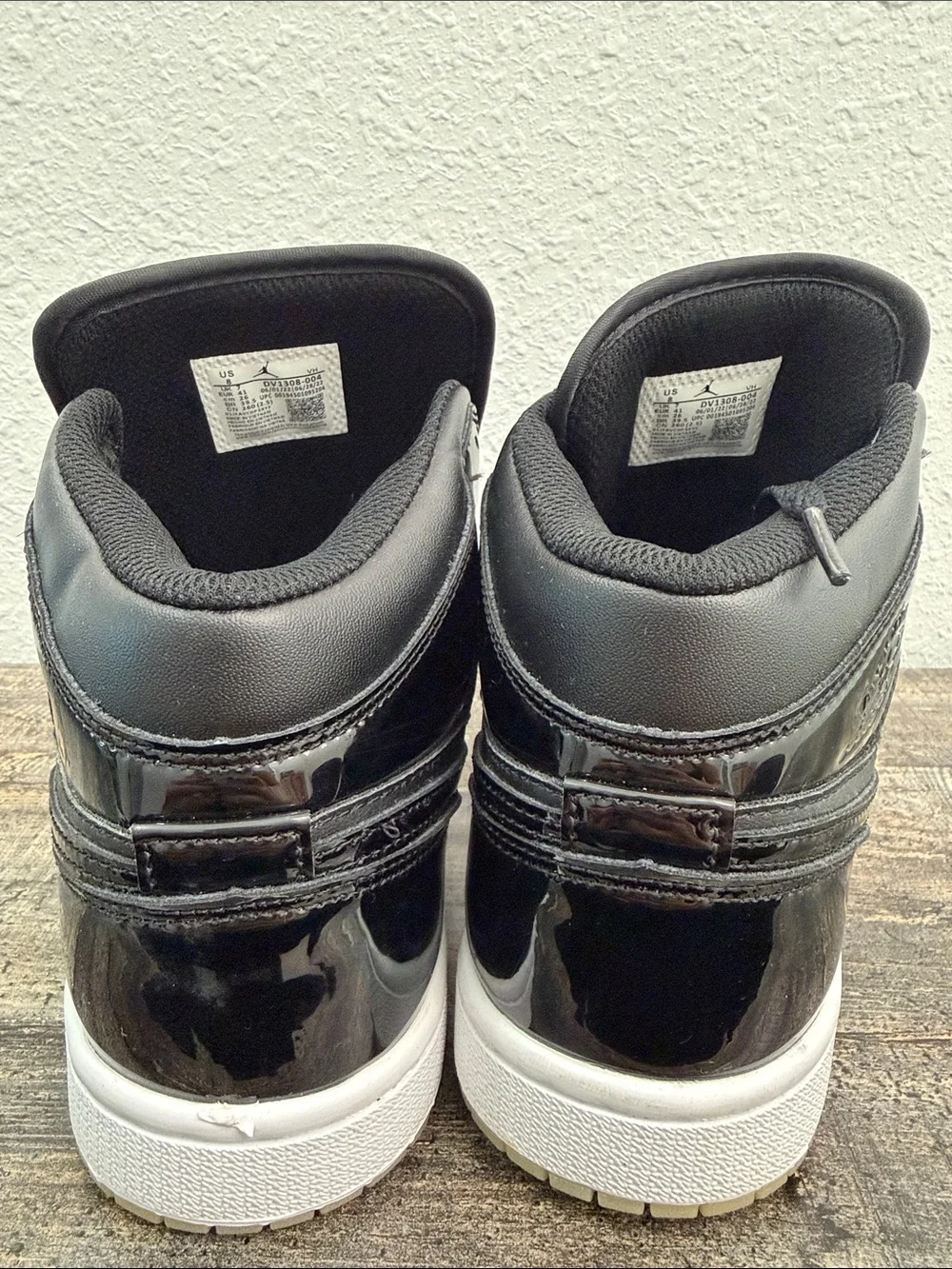 Jordan Black Patent Leather High-Top Sneakers with Purple Logo
